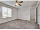 Bedroom featuring neutral carpet, a ceiling fan, and a window with views at 538 Ylang Pl, Henderson, NV 89015