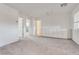 Spacious bonus room with neutral carpet, bright white walls, and built-in cabinets provides versatile living space at 538 Ylang Pl, Henderson, NV 89015