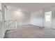 Bonus room features neutral carpet, bright white walls, and access to the balcony at 538 Ylang Pl, Henderson, NV 89015