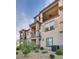 Three-story townhome with private balconies and desert landscaping at 538 Ylang Pl, Henderson, NV 89015