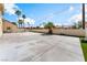 This home features a large backyard patio area with mature landscaping and tall privacy walls at 5516 Cory Pl, Las Vegas, NV 89107