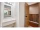 Bright bathroom vanity features a wide mirror and a bright vanity light fixture at 5516 Cory Pl, Las Vegas, NV 89107