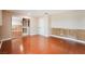 This is a spacious bedroom with wood floors and a closet with mirrored doors at 5516 Cory Pl, Las Vegas, NV 89107