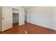 This is a bright bedroom with wood floors and a closet at 5516 Cory Pl, Las Vegas, NV 89107