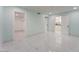 Bright bedroom featuring tile floors, light blue walls, and walk-in closet at 5516 Cory Pl, Las Vegas, NV 89107