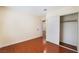 This is a bright bedroom with wood floors and a closet at 5516 Cory Pl, Las Vegas, NV 89107