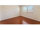 This is a bright bedroom with wood floors and a window at 5516 Cory Pl, Las Vegas, NV 89107