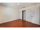 This is a bright bedroom with wood floors and a closet at 5516 Cory Pl, Las Vegas, NV 89107