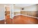 This is a spacious bedroom with wood floors and wood paneling at 5516 Cory Pl, Las Vegas, NV 89107