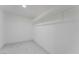 Walk-in closet with white walls, tile floors, and ample storage shelves at 5516 Cory Pl, Las Vegas, NV 89107