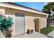 Exterior view of building featuring side door, air conditioner, and palm tree at 5516 Cory Pl, Las Vegas, NV 89107