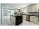 Modern kitchen featuring an island, stainless steel appliances, and ample counter space at 5516 Cory Pl, Las Vegas, NV 89107