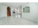 Expansive living area with fireplace, stairs, and a pass-through to another room at 5516 Cory Pl, Las Vegas, NV 89107