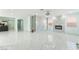 Bright and spacious living room features marble floors and modern fireplace at 5516 Cory Pl, Las Vegas, NV 89107