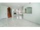 Open-concept living area featuring a fireplace, staircase, and arched pass-through at 5516 Cory Pl, Las Vegas, NV 89107