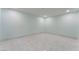 A clean, empty room, showcasing light blue walls and tile floors, ready for personalization at 5516 Cory Pl, Las Vegas, NV 89107