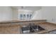 Clean kitchen with laminate counters, mosaic backsplash, and views to the living room at 5523 Orchard Ln # 0, Las Vegas, NV 89110