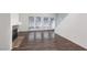 Spacious living room boasts laminate floors, a cozy fireplace, and sliding glass doors leading to a patio at 5523 Orchard Ln # 0, Las Vegas, NV 89110