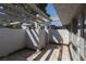 Exterior patio with stucco walls, a covered pergola, and a sliding glass door at 5523 Orchard Ln # 0, Las Vegas, NV 89110