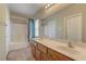 Bathroom featuring a double sink vanity and a bathtub with a shower at 5552 Dueces Wild Ct # 101, Las Vegas, NV 89122