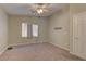 Neutral bedroom with a ceiling fan, a carpeted floor, and a window at 5552 Dueces Wild Ct # 101, Las Vegas, NV 89122