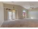 Bright and airy living room with vaulted ceilings and a sliding glass door leading to the outdoors at 5552 Dueces Wild Ct # 101, Las Vegas, NV 89122