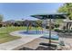 Community splash pad with picnic benches and manicured landscaping at 5552 Dueces Wild Ct # 101, Las Vegas, NV 89122