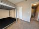 Comfortable bedroom features a bunkbed, neutral carpeting, and a closet with sliding doors at 5750 E Hacienda Ave # 107, Las Vegas, NV 89122