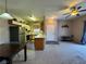 Open floor plan with a ceiling fan, dining area and kitchen views at 5750 E Hacienda Ave # 107, Las Vegas, NV 89122