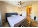Spacious main bedroom featuring carpet, a ceiling fan, and an ensuite bath at 5750 E Hacienda Ave # 107, Las Vegas, NV 89122