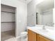 This bathroom includes a vanity, toilet, and walk-in closet at 6308 Anticline Ave, Las Vegas, NV 89139