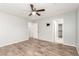 This bedroom offers wood-look flooring, neutral paint, and a ceiling fan at 6308 Anticline Ave, Las Vegas, NV 89139
