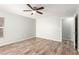 A bright bedroom features a ceiling fan and hardwood floors at 6308 Anticline Ave, Las Vegas, NV 89139