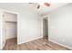 A bedroom includes wood-look floors and closet access at 6308 Anticline Ave, Las Vegas, NV 89139