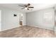 Bedroom showcasing wood-look floors, a ceiling fan, and neutral paint at 6308 Anticline Ave, Las Vegas, NV 89139