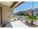 Inviting front porch with decorative tile flooring and wrought iron railing at 6308 Anticline Ave, Las Vegas, NV 89139