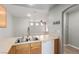 Open kitchen featuring recessed lighting, wooden cabinets and breakfast bar seating at 6308 Anticline Ave, Las Vegas, NV 89139