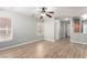 Spacious living room featuring hardwood floors, lots of natural light, and a ceiling fan at 6308 Anticline Ave, Las Vegas, NV 89139