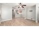 Open-concept living room with hardwood flooring and a view of the kitchen at 6308 Anticline Ave, Las Vegas, NV 89139