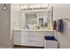 Bathroom featuring a double sink vanity, vanity lights, and a tiled floor at 6812 Coral Rock Dr, Las Vegas, NV 89108