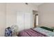 Cozy bedroom featuring a closet with sliding doors and a fan at 6812 Coral Rock Dr, Las Vegas, NV 89108