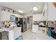 Bright kitchen with white cabinets, stainless steel appliances, and an eat-in breakfast bar at 6812 Coral Rock Dr, Las Vegas, NV 89108