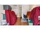 Living room filled with furniture and containers covered with red sheets at 6812 Coral Rock Dr, Las Vegas, NV 89108