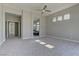 Spacious bedroom with plush carpet, recessed lights, and access to the bathroom and walk-in closet at 6845 Hidden Sunset Ln, Las Vegas, NV 89120