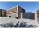 A long paver driveway leads up to the three car garage and gate for this single story home at 6845 Hidden Sunset Ln, Las Vegas, NV 89120