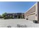 This single story home features a long paver driveway leading up to a three car garage at 6845 Hidden Sunset Ln, Las Vegas, NV 89120