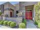 Paver walkway leads up to the red front door of this single story home at 6845 Hidden Sunset Ln, Las Vegas, NV 89120