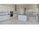 Bright and modern kitchen with stainless steel appliances, granite countertops, and tile backsplash at 6845 Hidden Sunset Ln, Las Vegas, NV 89120