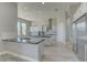 Gourmet kitchen with a large island, stainless steel appliances, and light gray cabinetry at 6845 Hidden Sunset Ln, Las Vegas, NV 89120