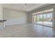 Spacious living room features sliding glass doors to the backyard and a bar area at 6845 Hidden Sunset Ln, Las Vegas, NV 89120